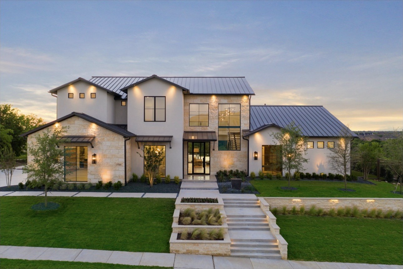 Aerial-style view of the estate elevation at dusk